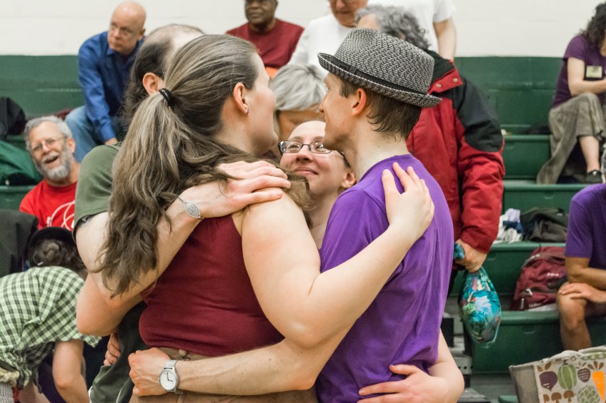 A circle of dancers relax together in a dance at the New England Folk Festival. Photo by Jeffrey Barry, used here under Creative Commons license with thanks.
