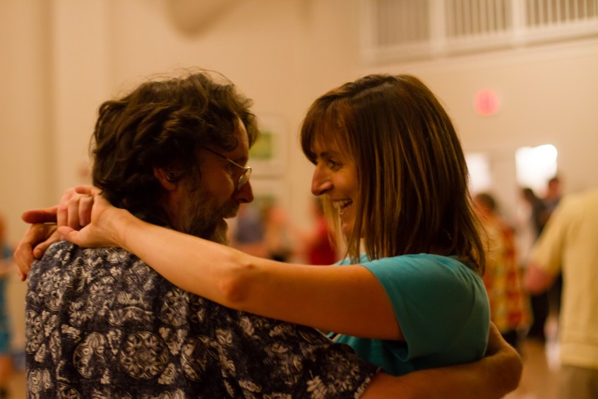 A pair smile on the dance floor. Photo by Sam Whited, used here under Creative Commons license with thanks.